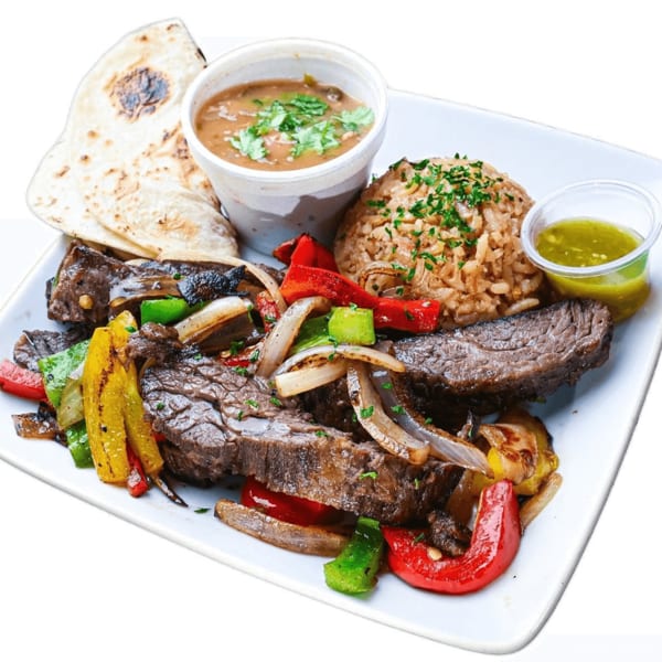 Grilled steak with sautéed peppers and onions, rice, beans, tortillas, and green sauce.